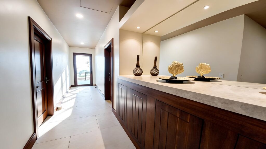 A spacious interior hallway with a double vanity provides added comfort and convenience for guests.