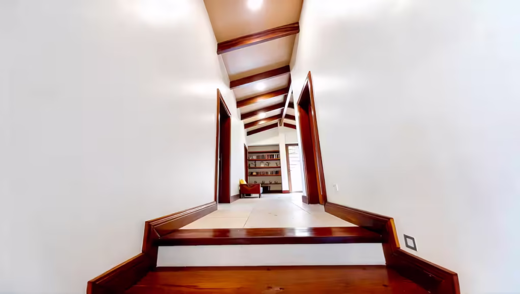 Vaulted ceilings, warm wood finishes, and open living spaces create a bright and welcoming atmosphere throughout the home.