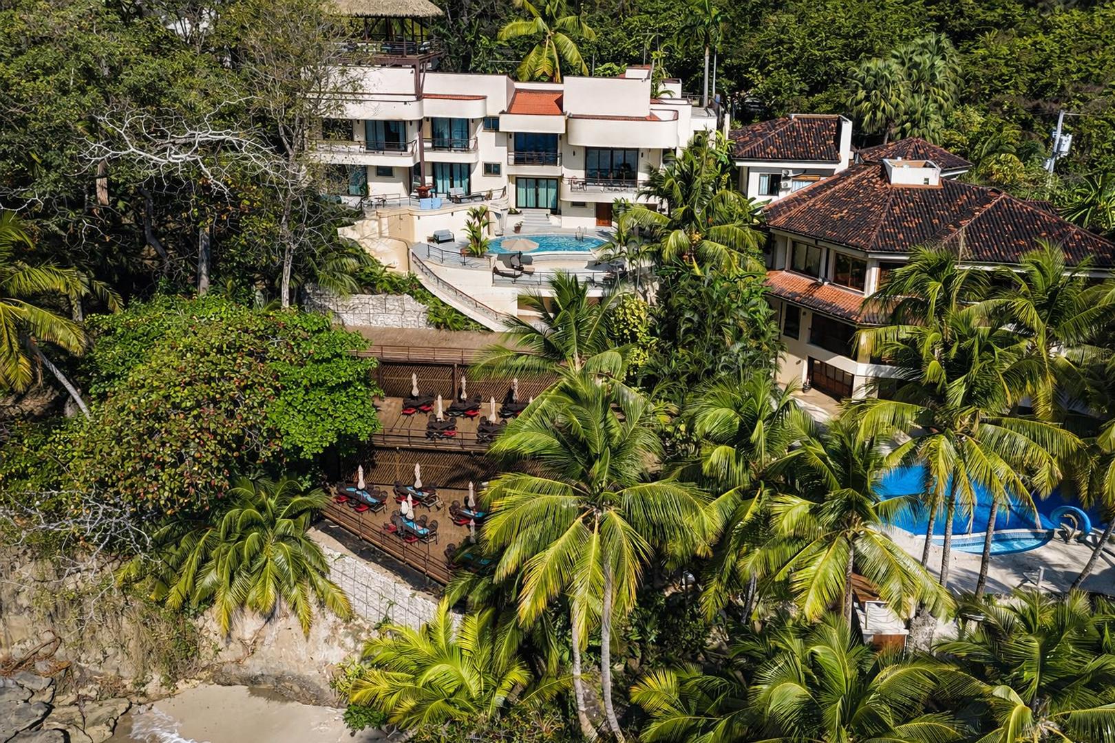Aerial view of a luxury beachfront vacation villa with private pool on Costa Rica's Pacific coast