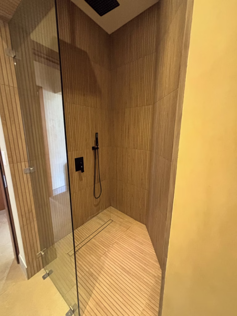 The walk-in rainfall shower provides a refreshing place to unwind after beach days and outdoor adventures.