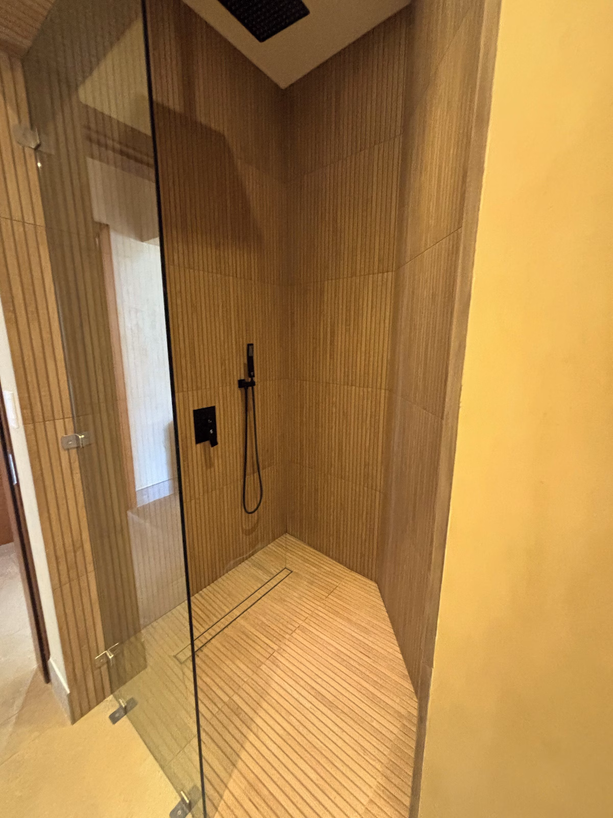 Walk-in rainfall shower in a Costa Rica family vacation villa bathroom