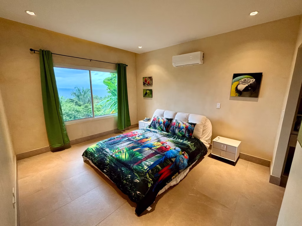 Inspired by Costa Rica's colorful birdlife, this cheerful bedroom combines tropical character with comfortable accommodations.