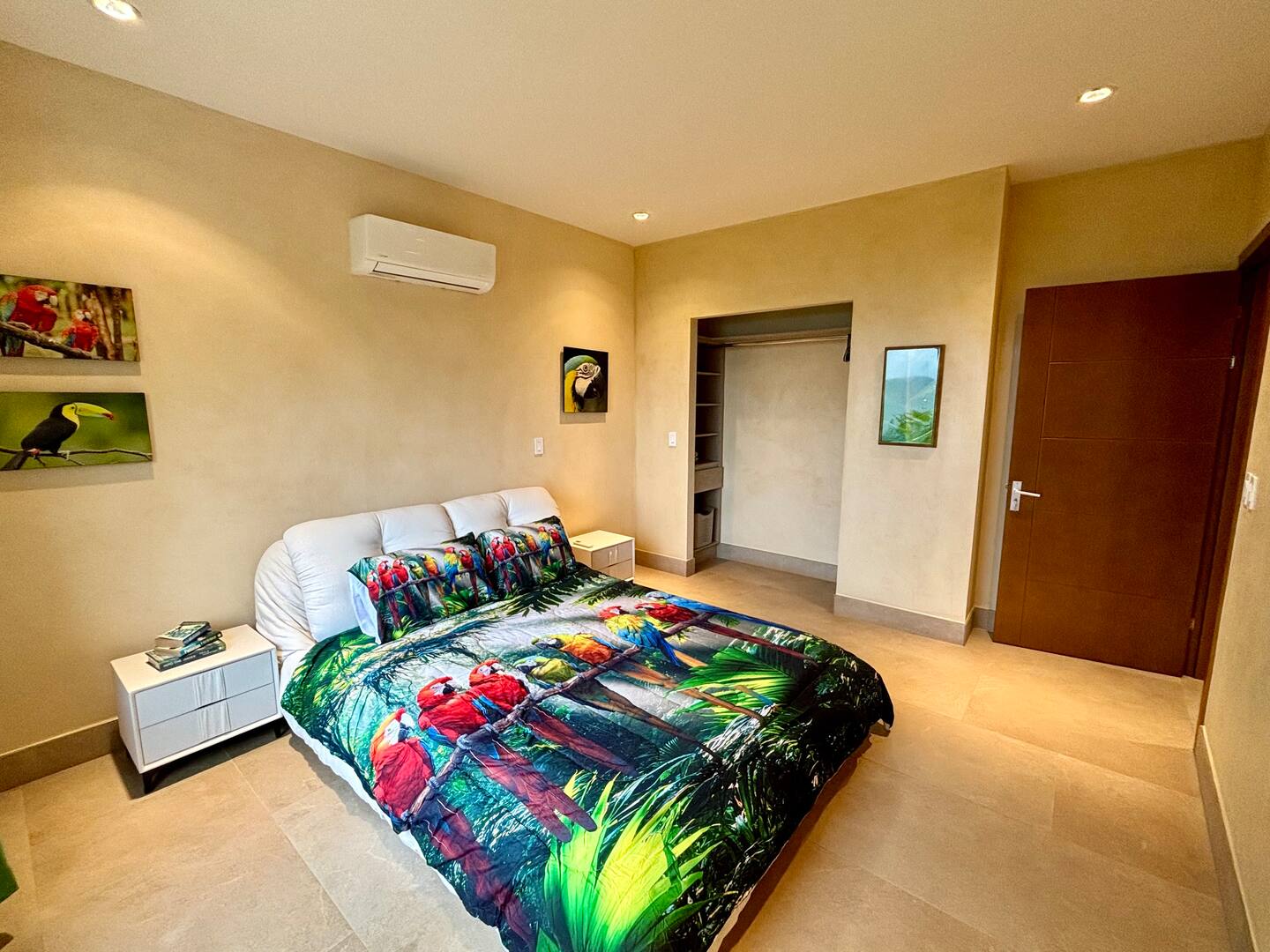 Colorful macaw-themed guest bedroom at a family vacation villa in Costa Rica