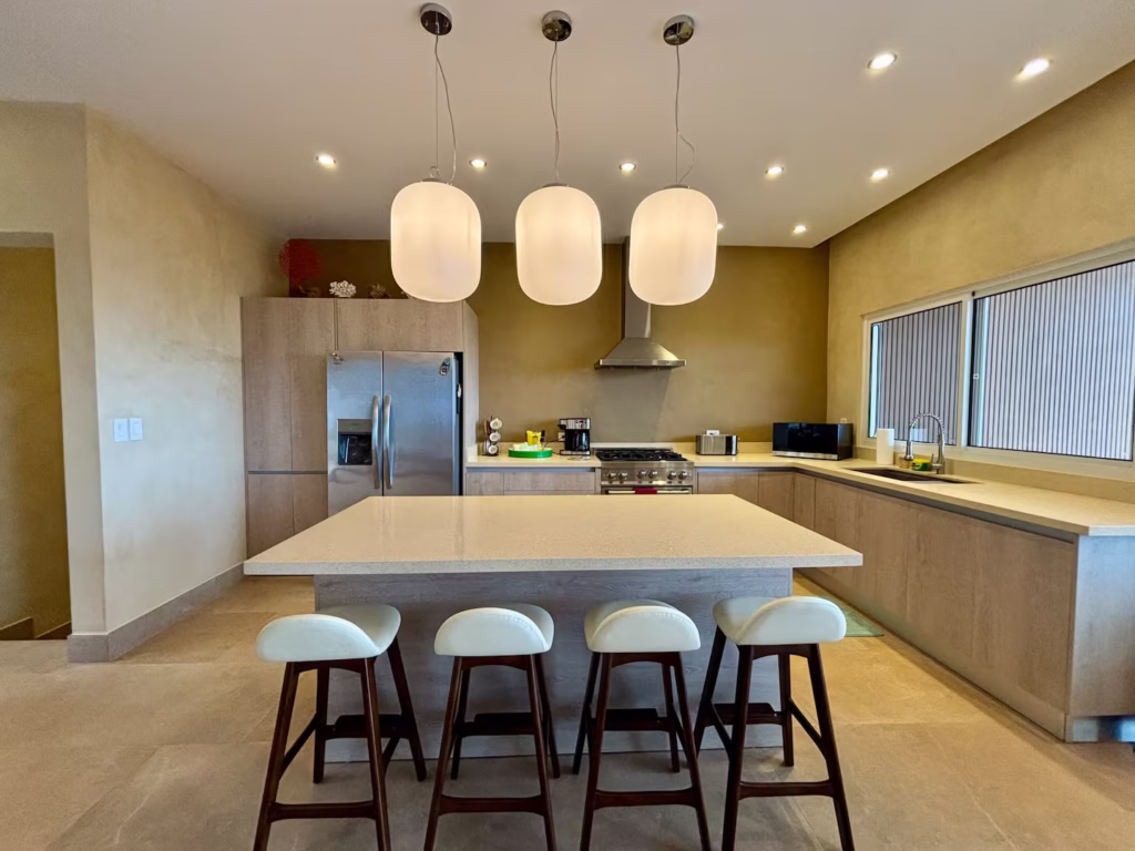 The large kitchen island becomes the center of family breakfasts, casual meals, and planning tomorrow's adventures.