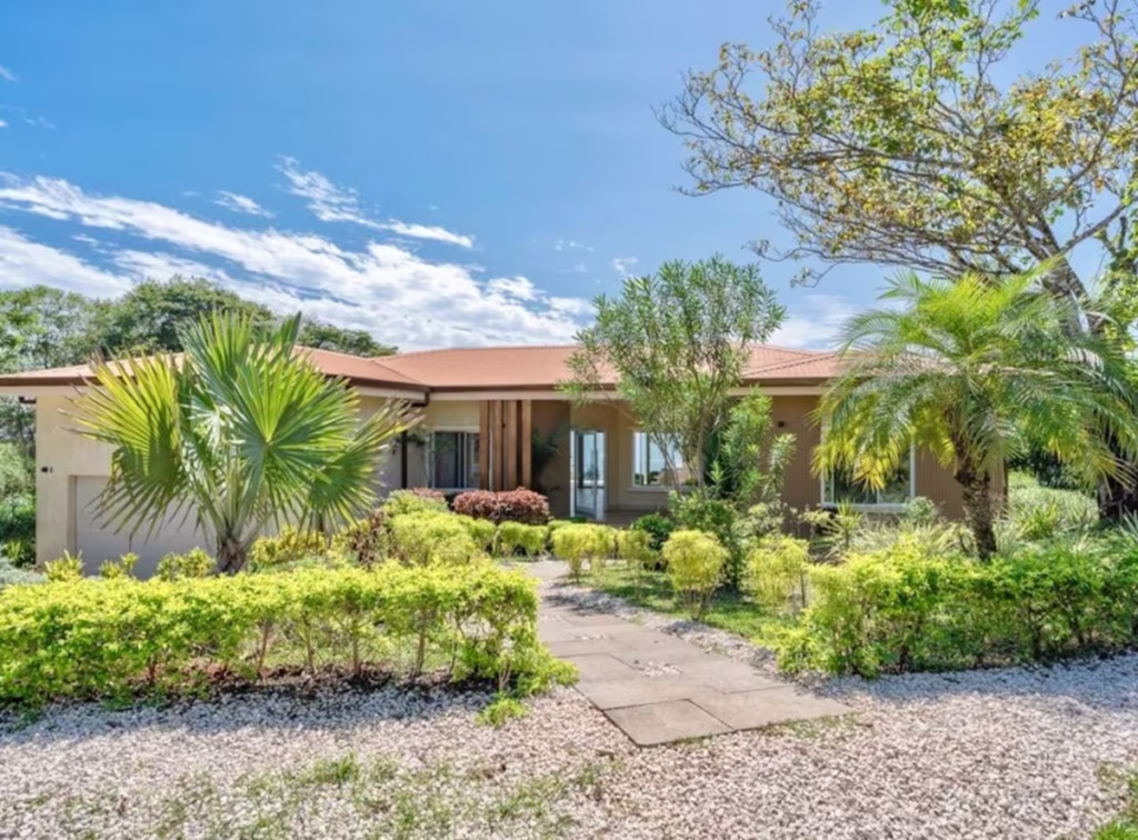 A welcoming entrance surrounded by tropical landscaping sets the tone for a peaceful vacation on the Nicoya Peninsula.